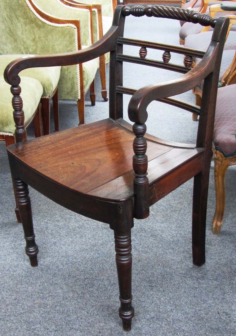 Appraisal: A pair of early th century mahogany carver chairs with