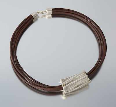 Appraisal: A Sterling Silver and Leather Necklace Sterling silver enhancer over