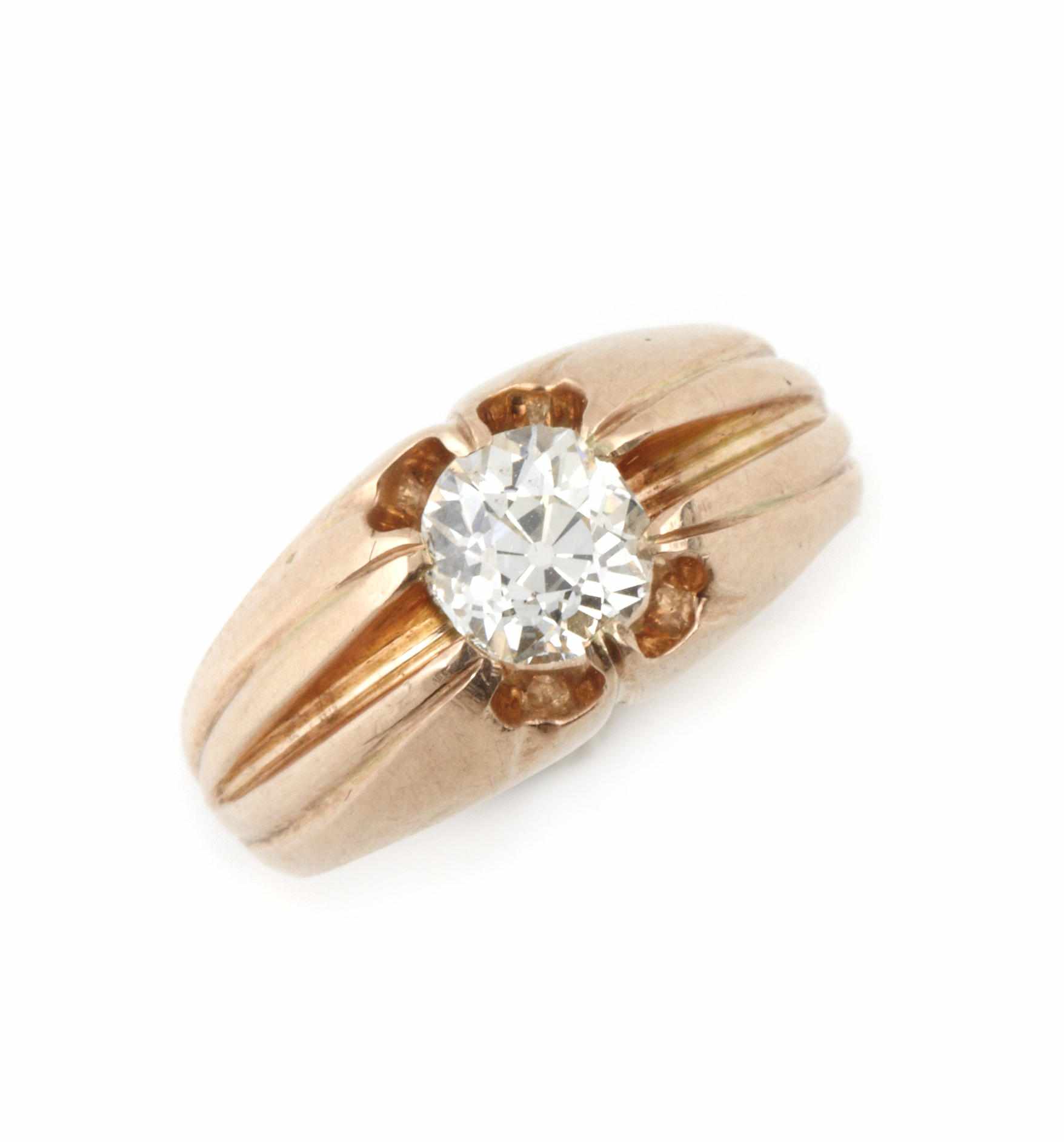 Appraisal: A diamond solitaire and gold ring centering an old European-cut