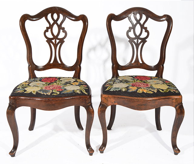 Appraisal: A PAIR OF ANTIQUE CONTINENTAL PROVINCIAL CHAIRS with pierced backs