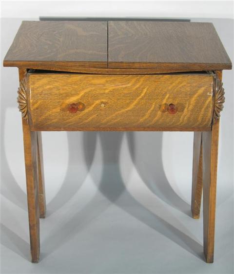 Appraisal: VICTORIAN STYLE OAK SIDE TABLE The rectangular top over single