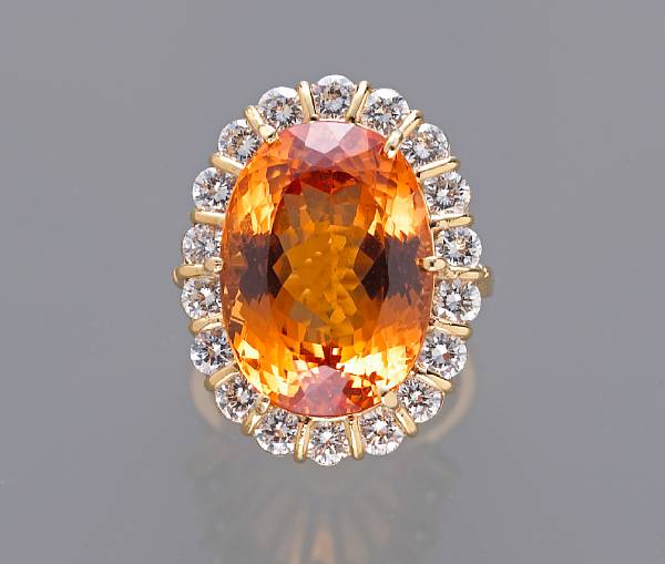 Appraisal: A precious topaz and diamond ring topaz weighing an estimated