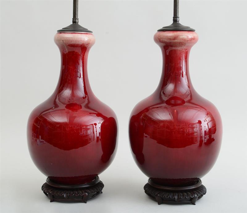 Appraisal: PAIR OF CHINESE FLAMB -GLAZED PORCELAIN BOTTLE-FORM VASES On carved