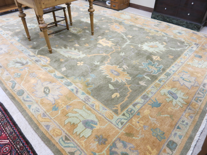 Appraisal: A CONTEMPORARY TIBETAN CARPET hand knotted in a stylized floral