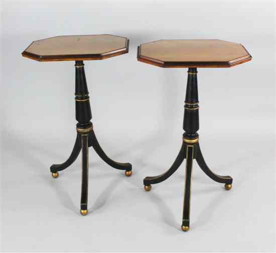 Appraisal: A pair of Regency design satinbirch and ebonised tripod tables