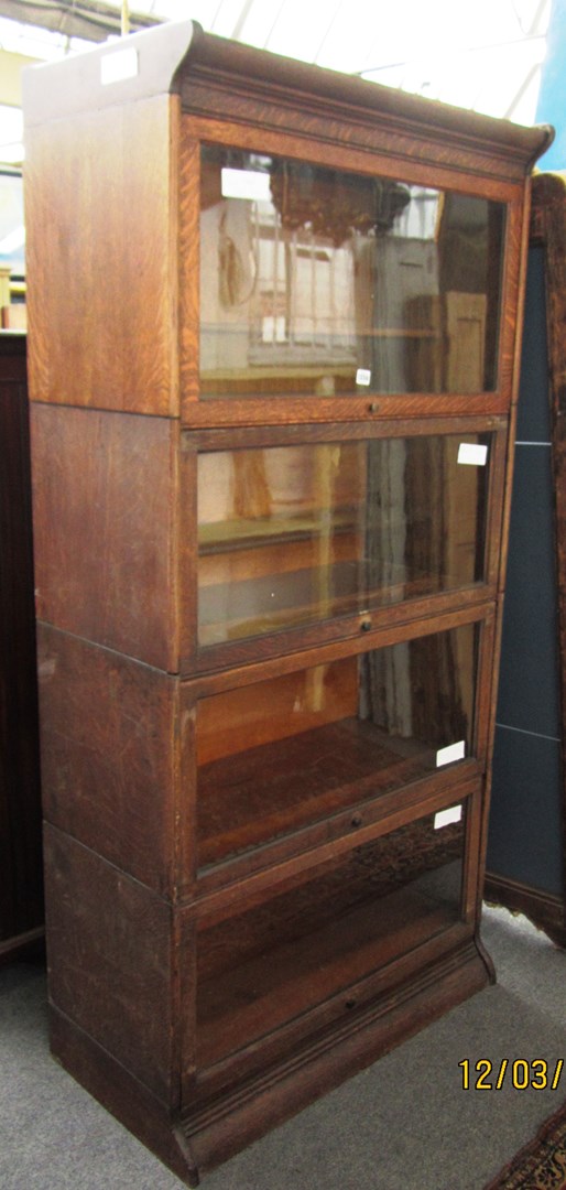 Appraisal: A th century oak four section Globe Wernicke style bookcase