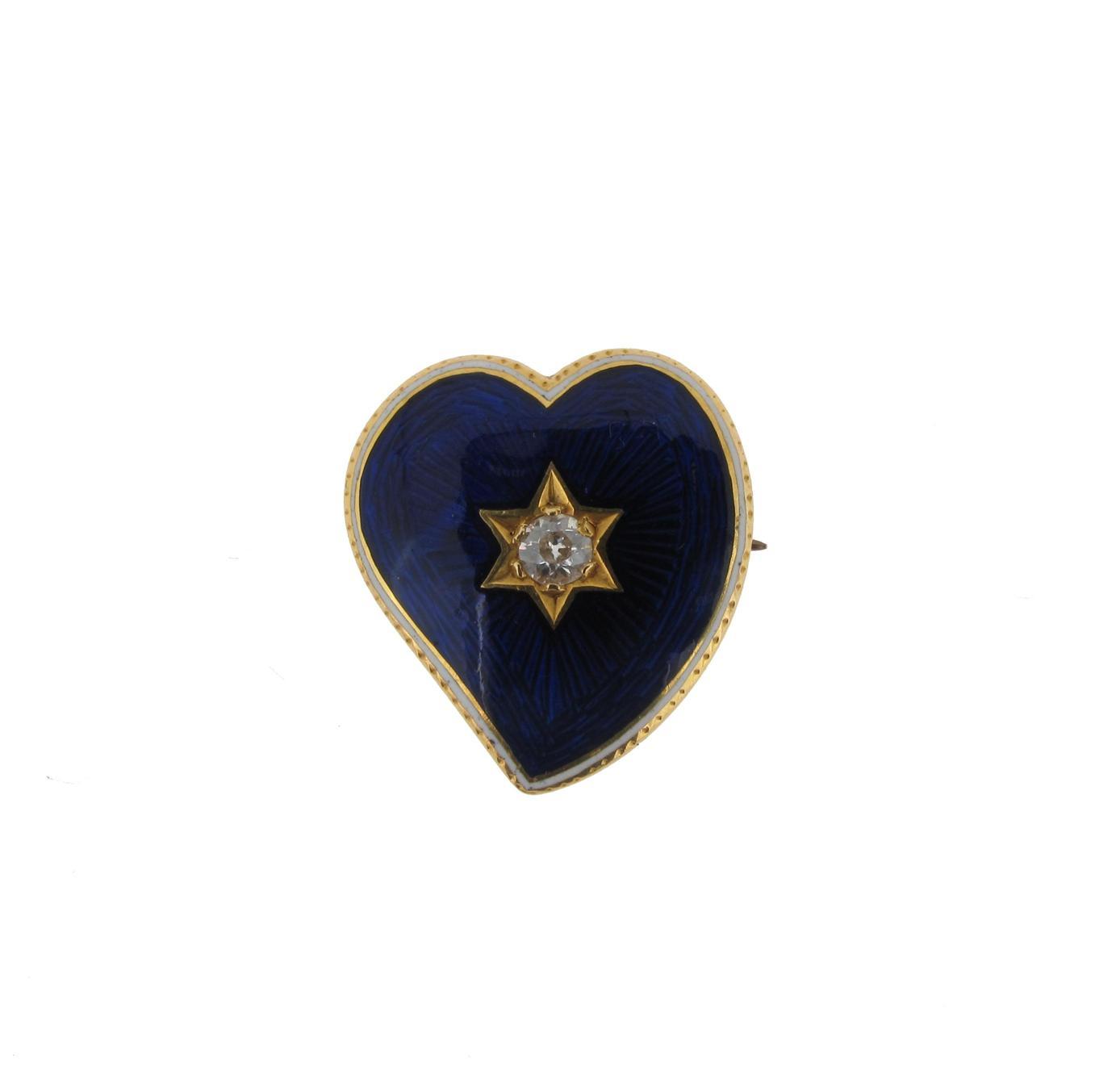 Appraisal: A gold heart shaped brooch centred with a circular cut