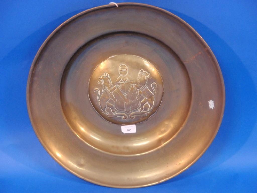 Appraisal: A brass armorial charger embossed to the centre with lion