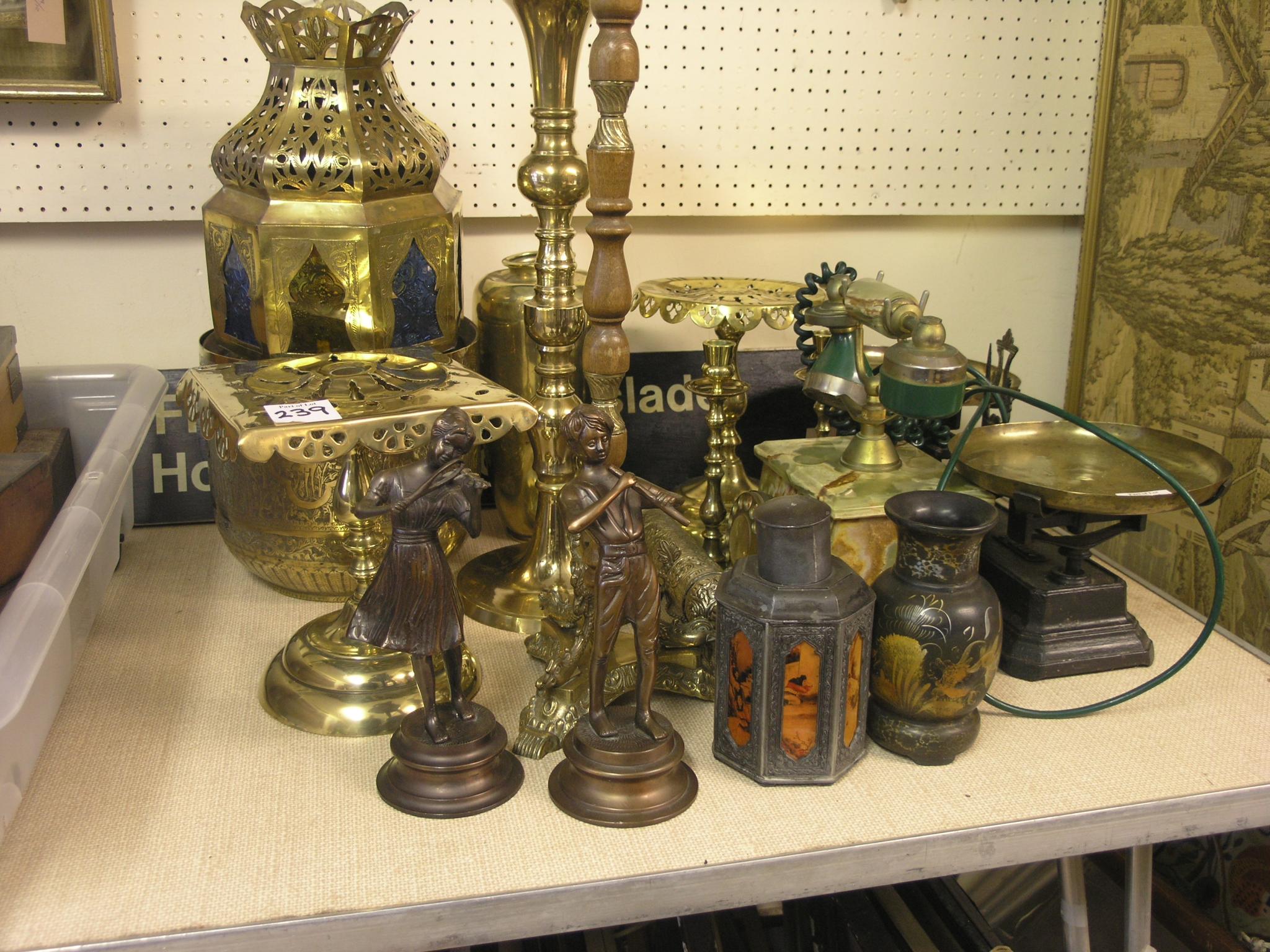 Appraisal: A brass jardiniere on stand in two further brass jardiniere