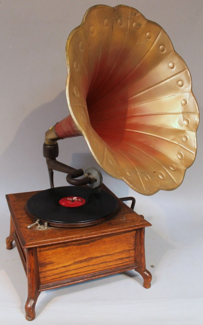 Appraisal: A thC oak cased table top gramophone with tin horn