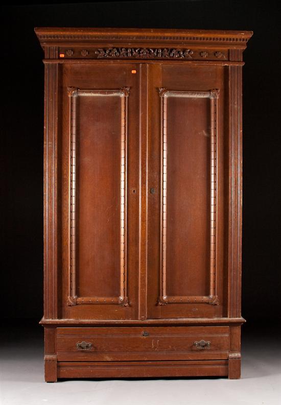 Appraisal: Late Victorian carved oak two-door wardrobe fourth quarter- th century