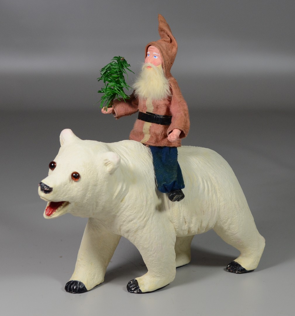 Appraisal: Felt paper mache Santa riding a molded composition polar bear