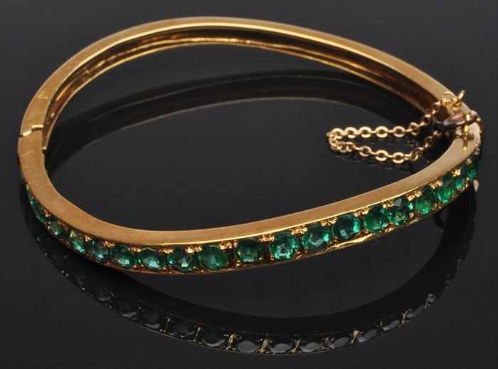 Appraisal: GOLD AND EMERALD BANGLE BRACELET Stamped k