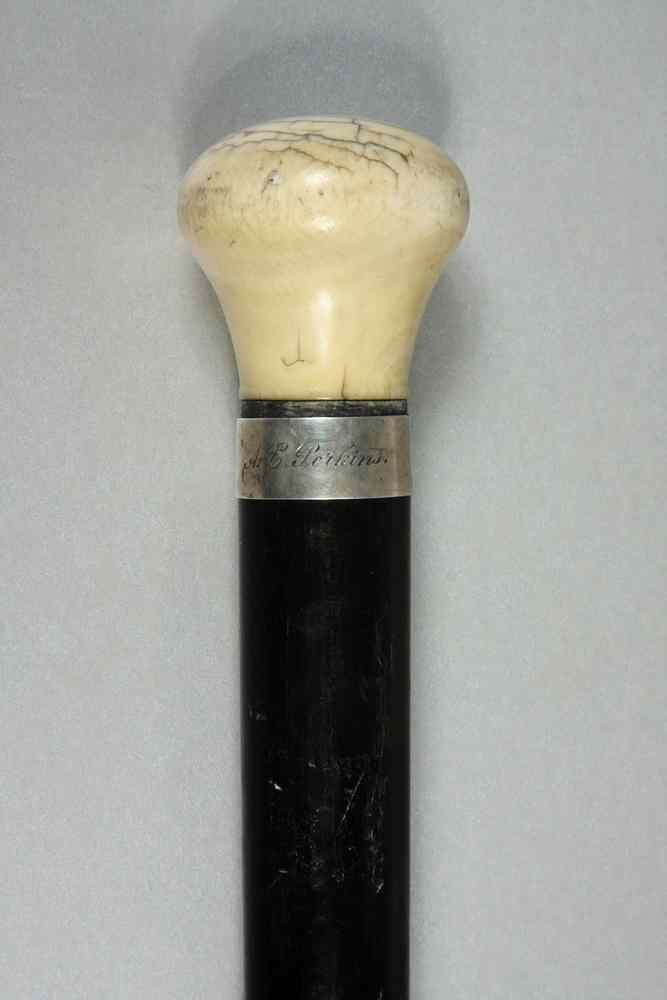 Appraisal: WALKING STICK - th c ebony walking stick with turned