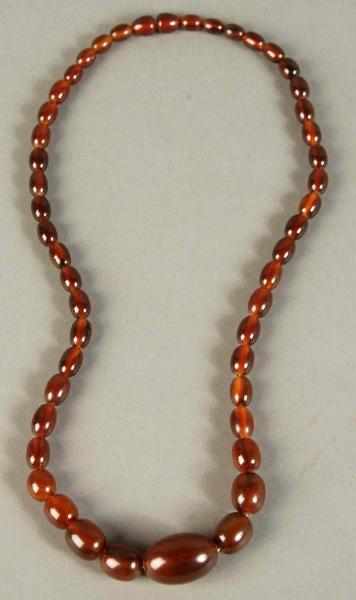 Appraisal: Dark Amber Bakelite Beaded Necklace Condition Excellent Size L