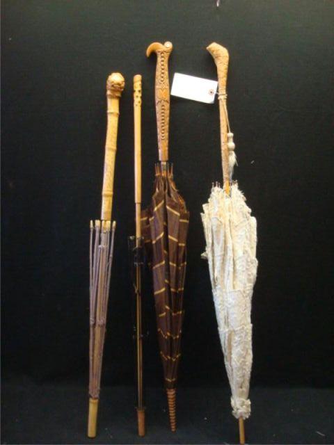 Appraisal: Four Victorian Parasols with Carved Handles Estimate -