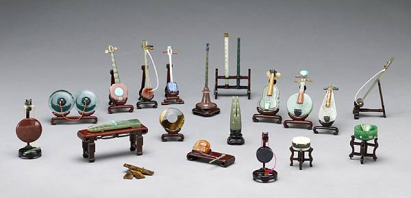 Appraisal: A group of twenty-four pieced stone miniature musical instruments th