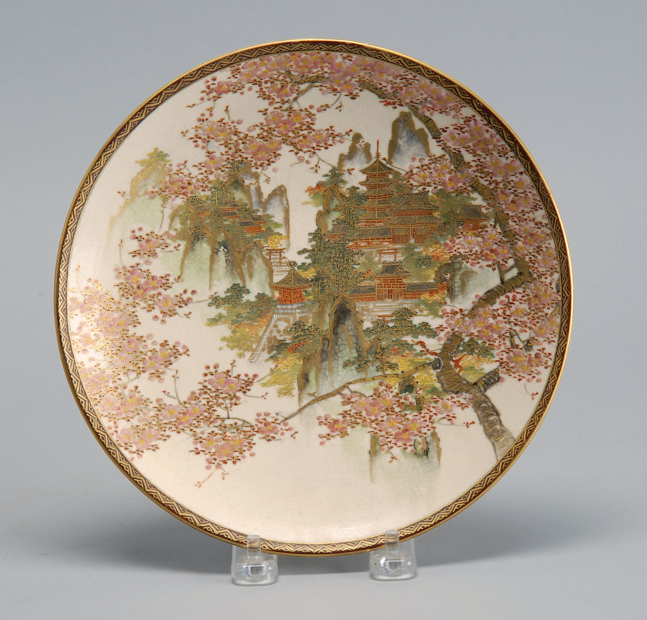 Appraisal: SATSUMA PLATE Early th CenturyWith pagoda and cherry blossom decoration