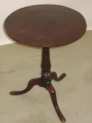 Appraisal: A GEORGE III MAHOGANY TRIPOD TABLE the top of circular