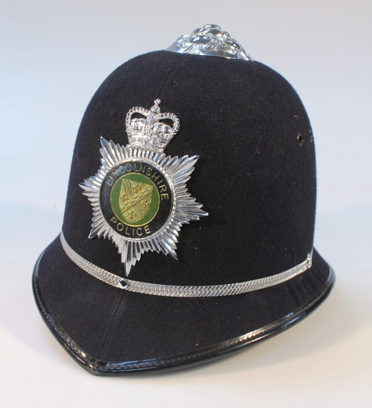 Appraisal: A Custodian Cromwell Lincolnshire police helmet with Lincolnshire badge part