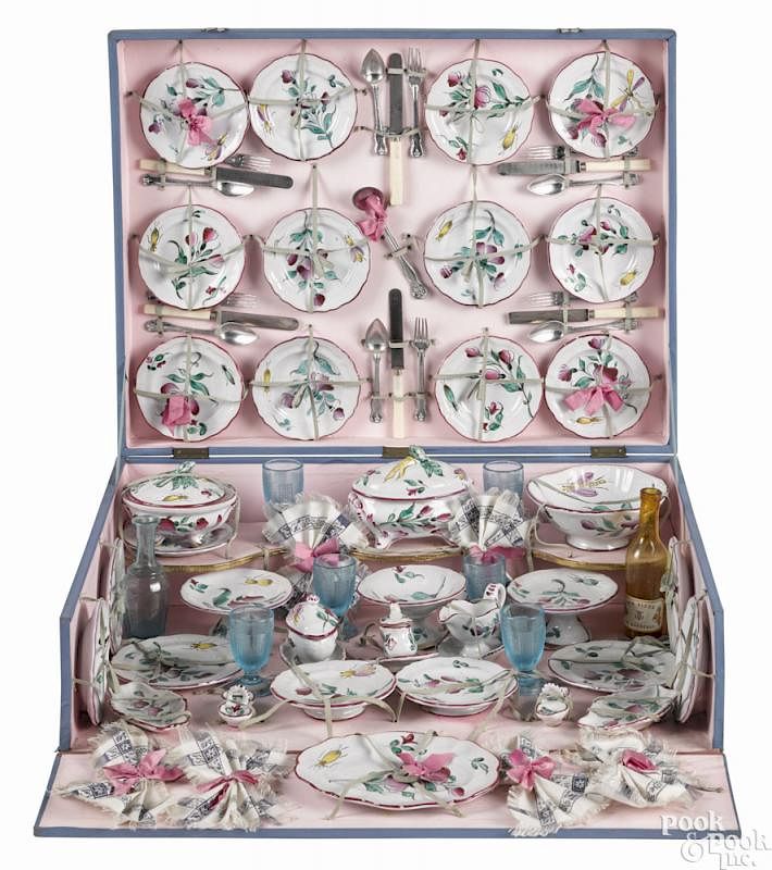 Appraisal: French child's enameled porcelain dinner service in its original presentation