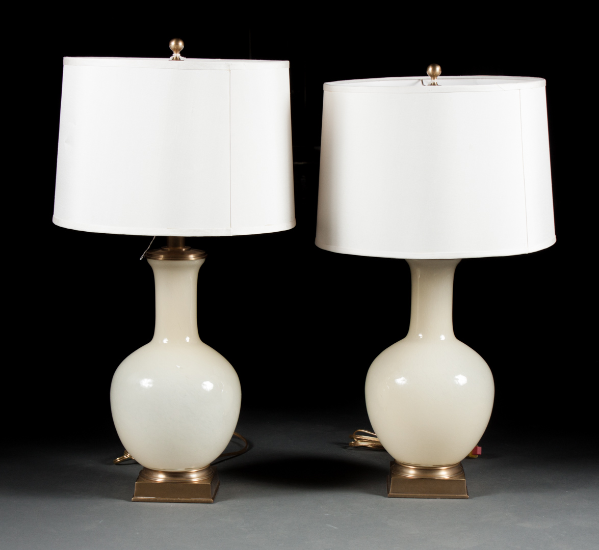 Appraisal: Pair of opalescent glass bottle-form lamps mounted on brass bases