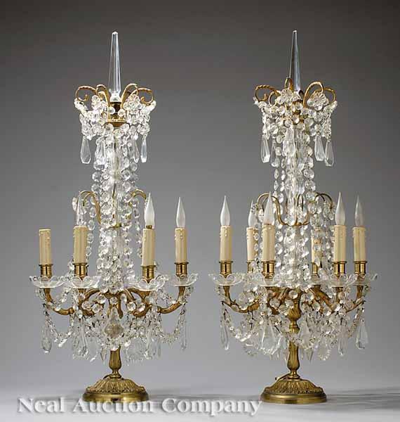 Appraisal: A Pair of Brass Prism-Hung Candelabra the laurel leaf-decorated base