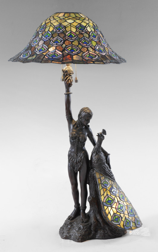 Appraisal: CONTEMPORARY ART DECO MAIDEN WITH PEACOCK LAMP Cast metal figure