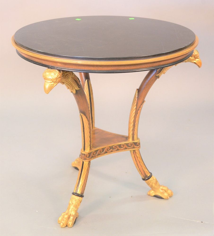 Appraisal: Granite top table with gilt eagle head supports ht dia