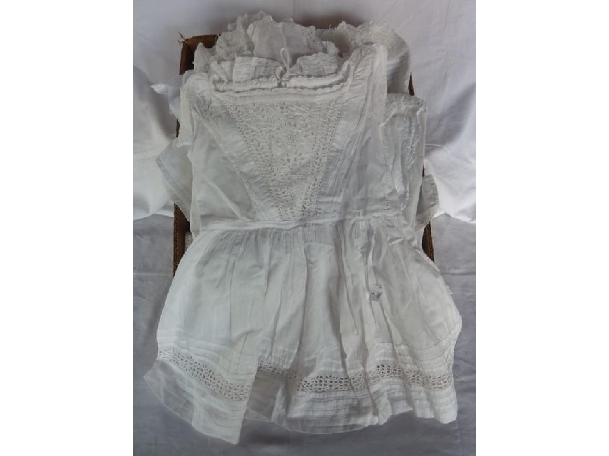 Appraisal: A small quantity of white cotton baby gowns together with