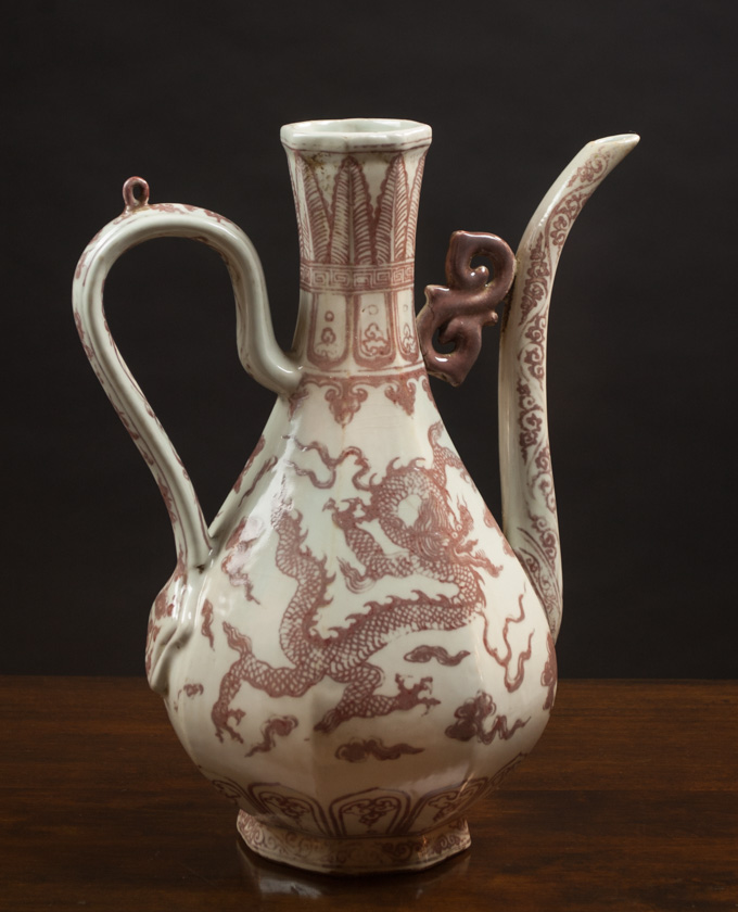 Appraisal: CHINESE MING STYLE POTTERY WINE POT having an iron-red three-toed