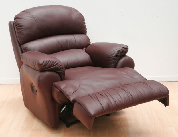 Appraisal: A maroon leather upholstered armchair