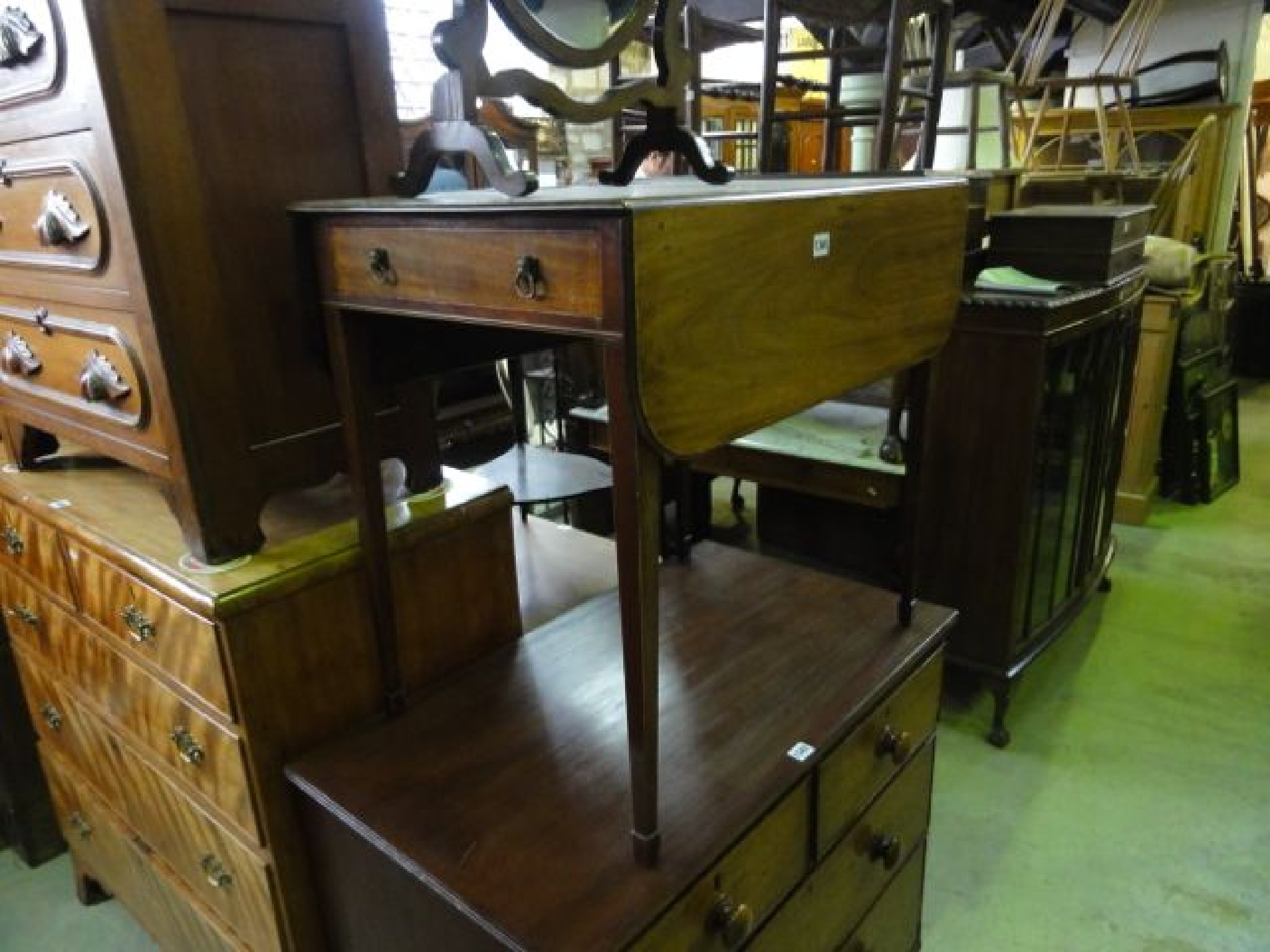 Appraisal: A small Georgian mahogany Pembroke table the top with moulded