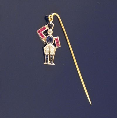 Appraisal: A gem set gold stick pin depicting a stylized soldier