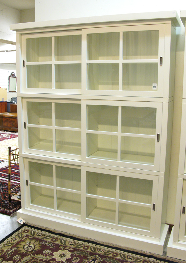 Appraisal: CONTEMPORARY THREE-LEVEL WHITE DISPLAY CABINET manufactured having three stacking horizontal