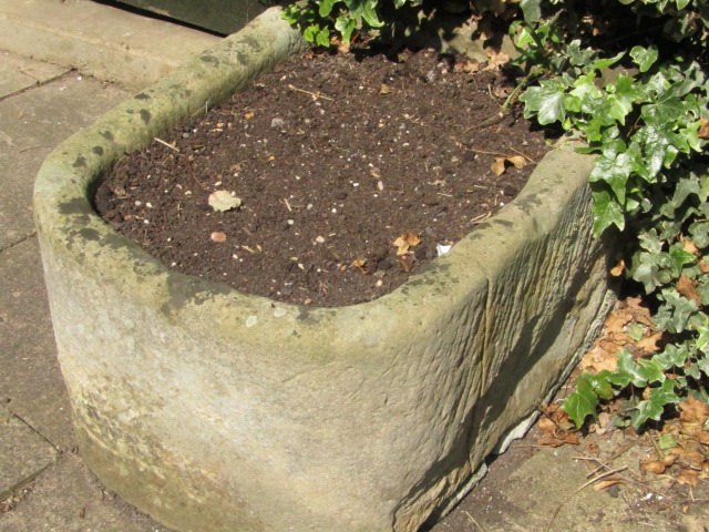 Appraisal: A hand hewn stone bullnose trough cm x cm cm