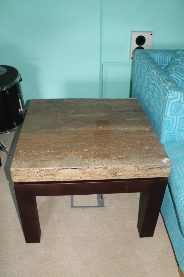 Appraisal: An encased marble top coffee table on leather finish stand