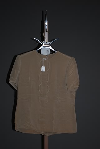 Appraisal: Andr Laug tan circle embroidery short sleeve silk blouse Approx