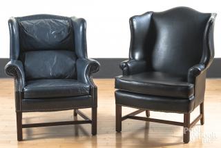 Appraisal: Two leather upholstered wing chairs