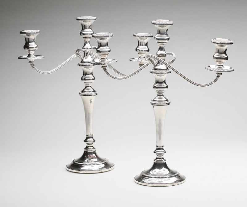 Appraisal: A pair of Fisher sterling silver convertible three-light candelabra Mid-