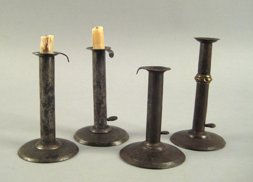 Appraisal: Four tin hogscraper candlesticks th th c one with brass