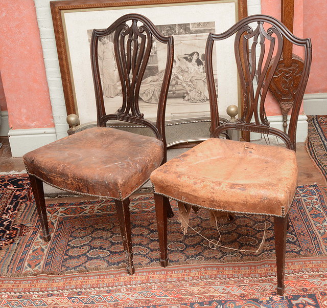 Appraisal: A PAIR OF GEORGIAN MAHOGANY DINING CHAIRS with shield shaped