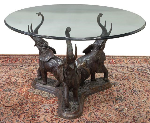 Appraisal: Bronze elephant center table th c circular glass top with