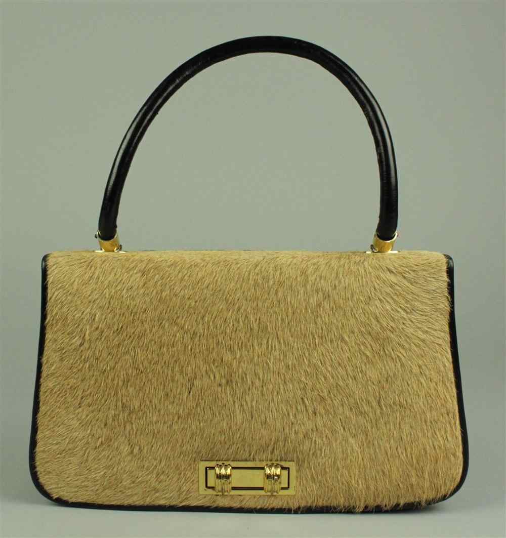 Appraisal: LADY'S LION SKIN AND LEATHER HANDBAG with brass turning clasp