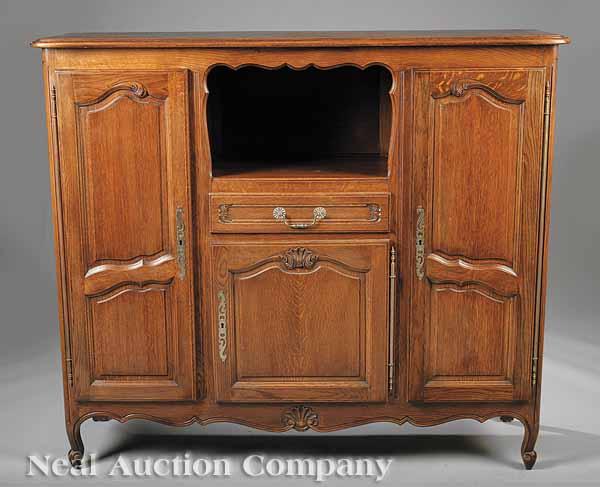 Appraisal: A French Provincial-Style Carved Oak Desserte in the Louis XVI