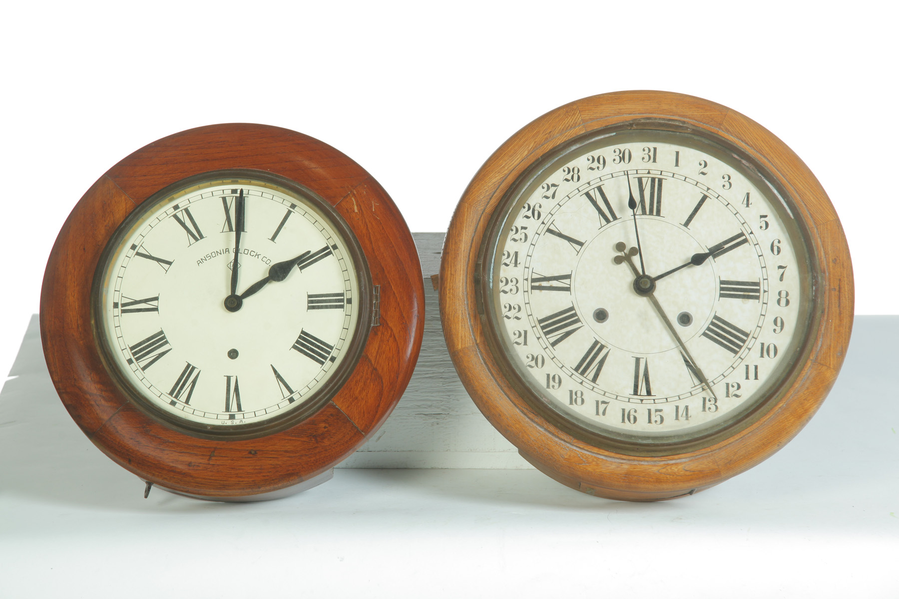 Appraisal: TWO ROUND HANGING WALL CLOCKS American th quarter- h century