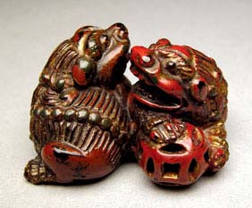 Appraisal: ANTIQUE LACQUER NETSUKE Antique carved red lacquer netsuke of two