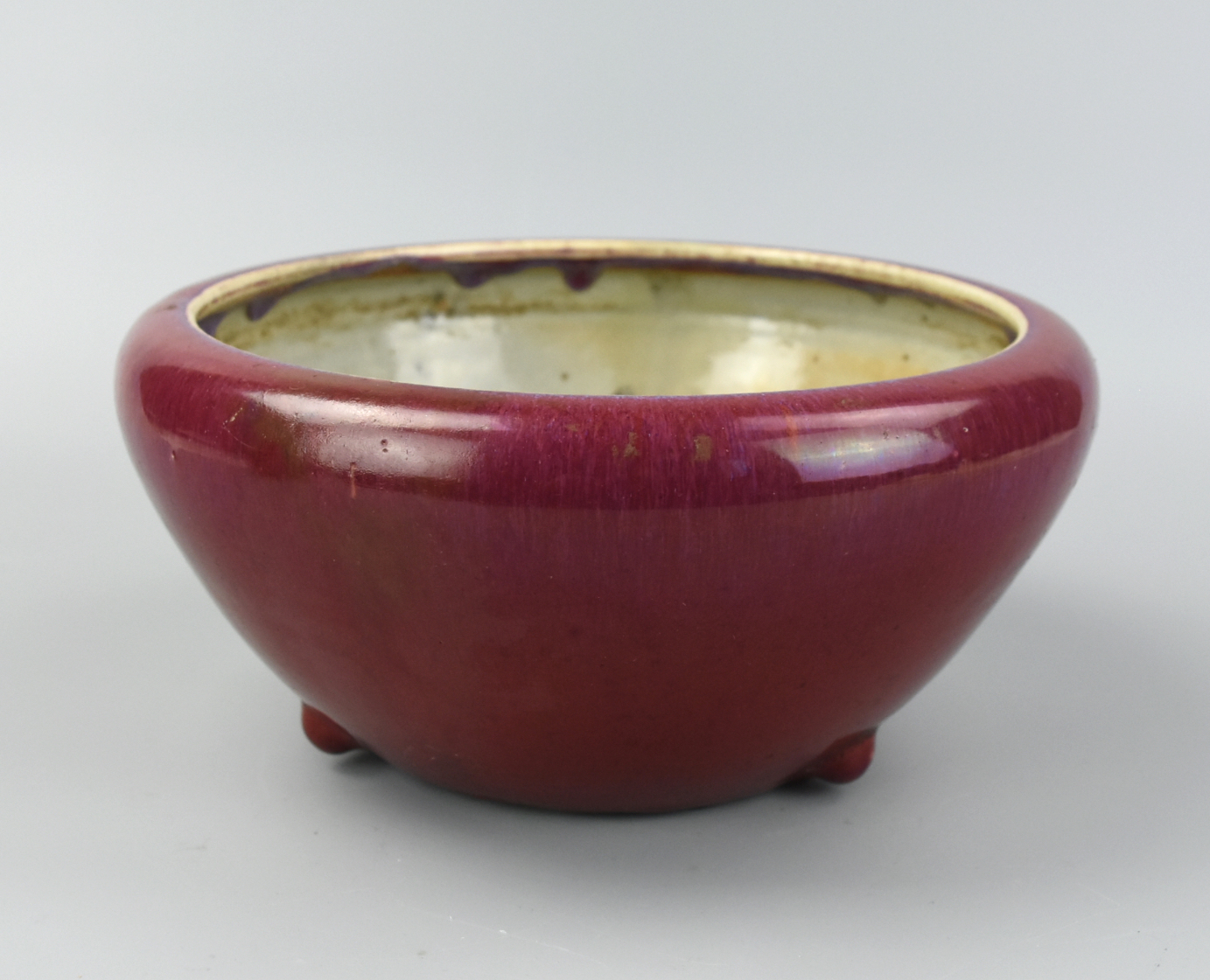 Appraisal: CHINESE RED GLAZE FLAMBE TRIPOD CENSER TH C Chinese th