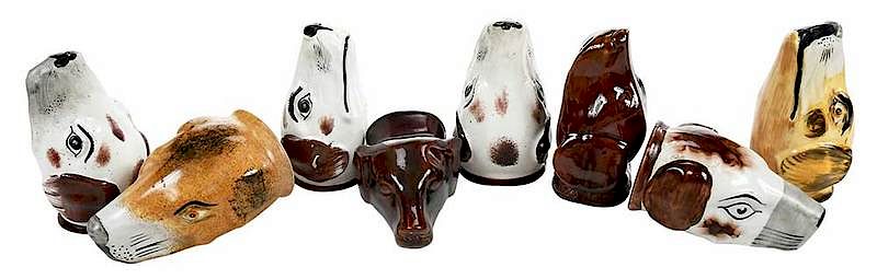 Appraisal: Eight Hound Ceramic Stirrup Cups British th century six pearlware