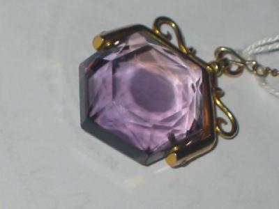 Appraisal: AN AMETHYST SWIVEL FOB the hexagonal faceted stone on ct